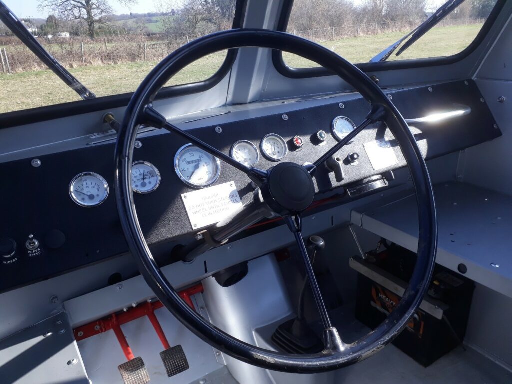 Interior of a 1968 Activ Snow-Trac restoration project, showing the dashboard including steering wheel