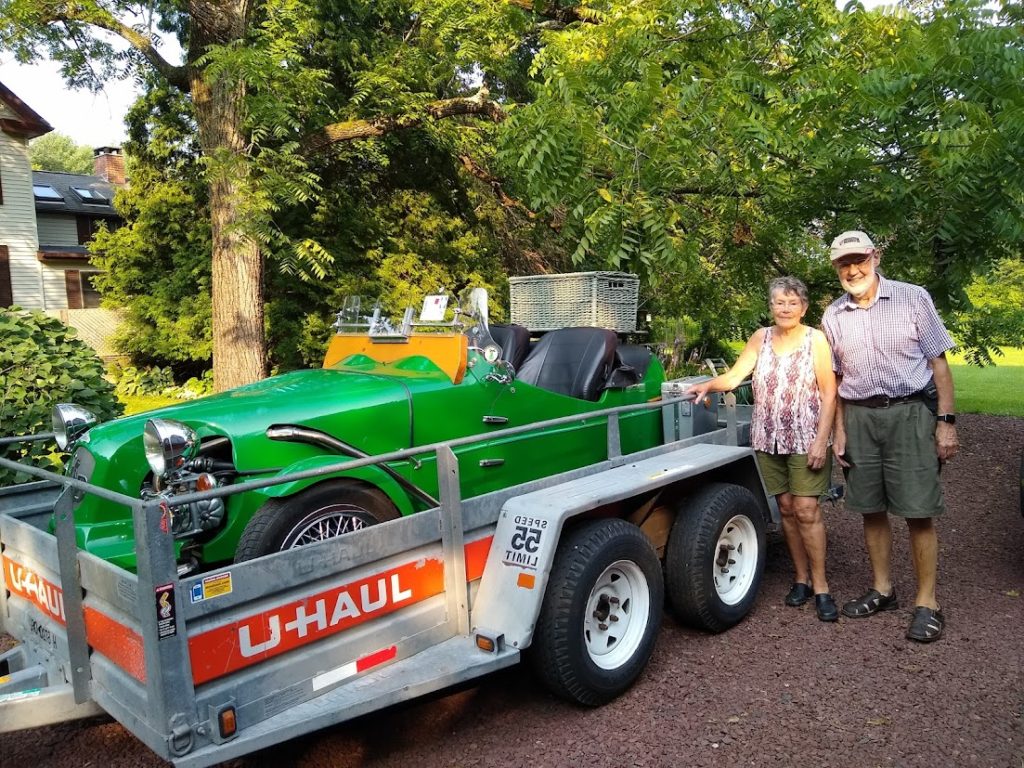 Mr Lomax posing next to his Lomax 223 on arrival at his home in the USA following shipment from the UK by Autoshippers