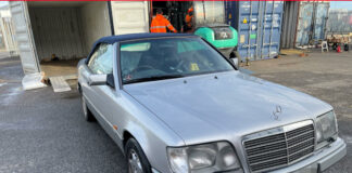 Front view of a silver 1995 Mercedes E320 Cabriolet before shipping from the UK to Brisbane, Australia, with Autoshippers.