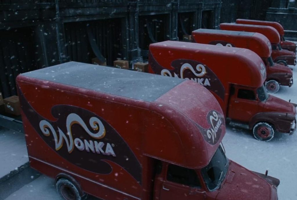 Scene from the 2005 film Charlie and the Chocolate Factory showing the iconic Wonka Bedford vans.