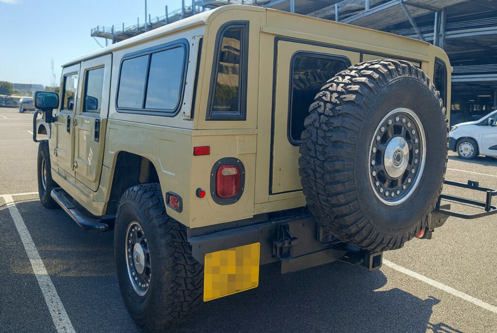 Rear view of the Hummer H1 Alpha with its spare wheel, shipped by Autoshippers from Dorking, UK, to Brunswick, USA.
