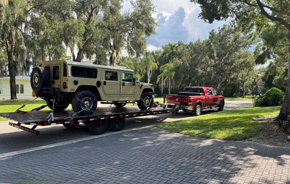 Hummer H1 Alpha on a vehicle trailer after shipping by Autoshippers from Dorking, UK, to Brunswick, USA.