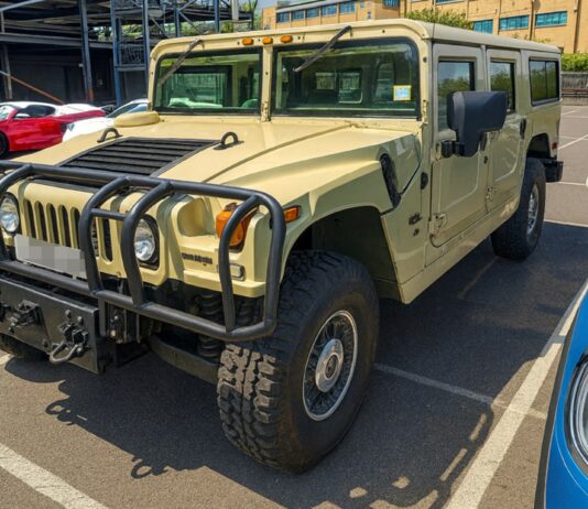 Front view of a beige Hummer H1 Alpha shipped by Autoshippers from Dorking, UK, to Brunswick, USA.