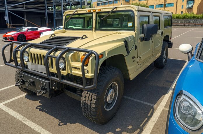 Front view of a beige Hummer H1 Alpha shipped by Autoshippers from Dorking, UK, to Brunswick, USA.
