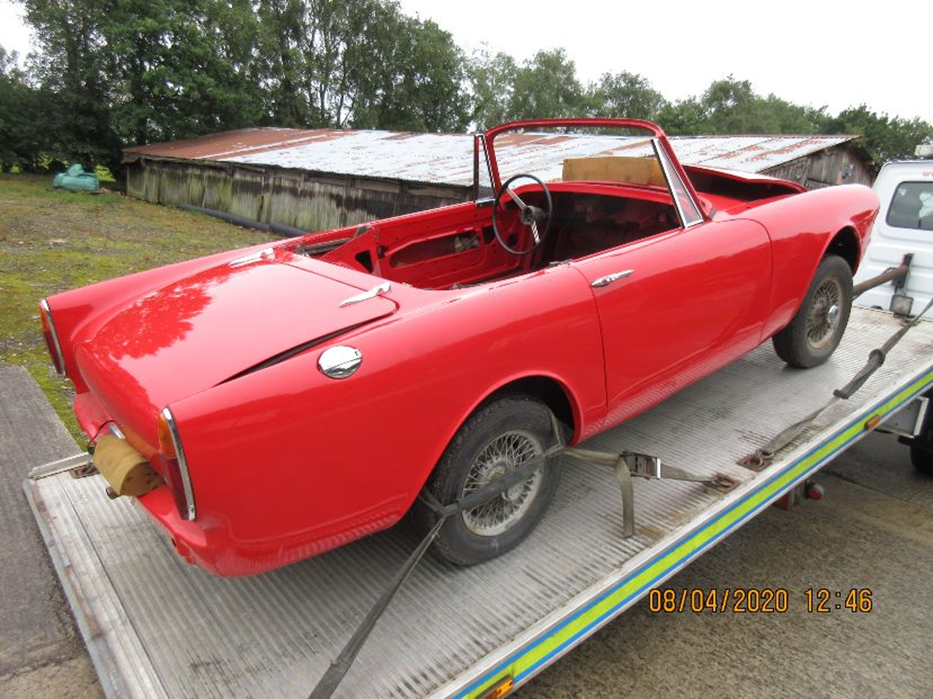1967 Sunbeam Alpine when it was bought by the customer in the UK, secured to a trailer.