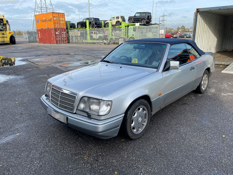 Silver Mercedes E320 Cabriolet beside an open container before shipping from the UK to Brisbane with Autoshippers.