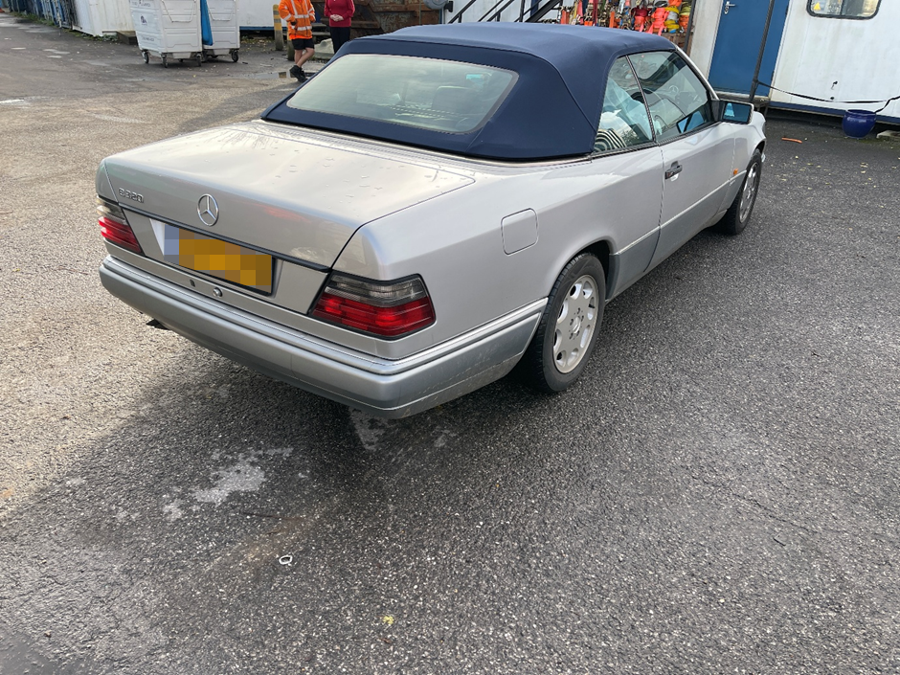 Rear view of the Mercedes E320 Cabriolet with its blue soft top, ready for shipping from the UK to Brisbane with Autoshippers.