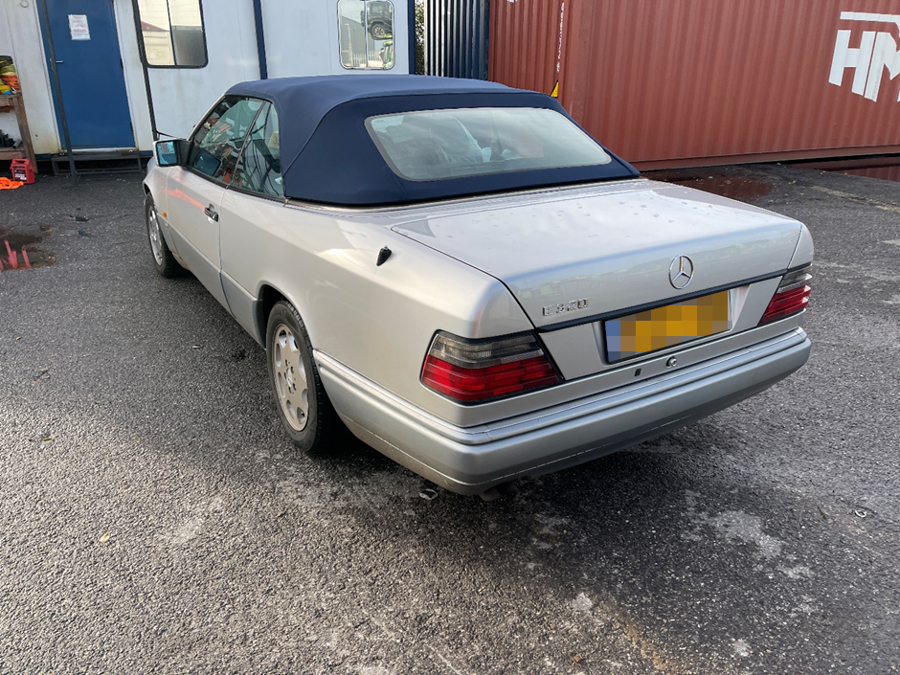 Rear-left view of the Mercedes E320 Cabriolet awaiting container loading for its UK-to-Brisbane shipment with Autoshippers.