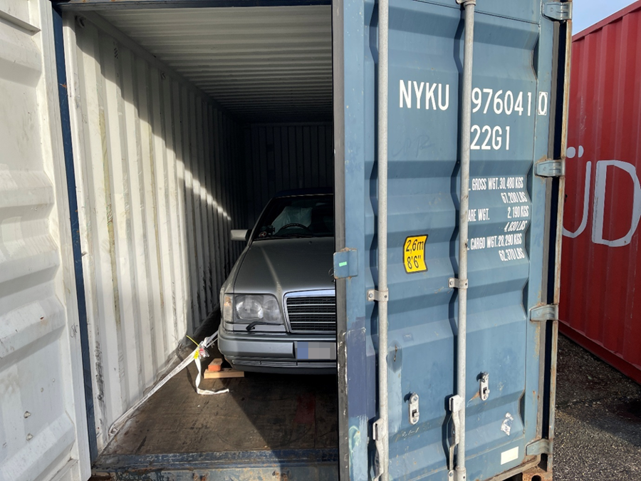 Mercedes E320 Cabriolet inside its shipping container with one door closed, ready for its UK-to-Brisbane journey with Autoshippers.