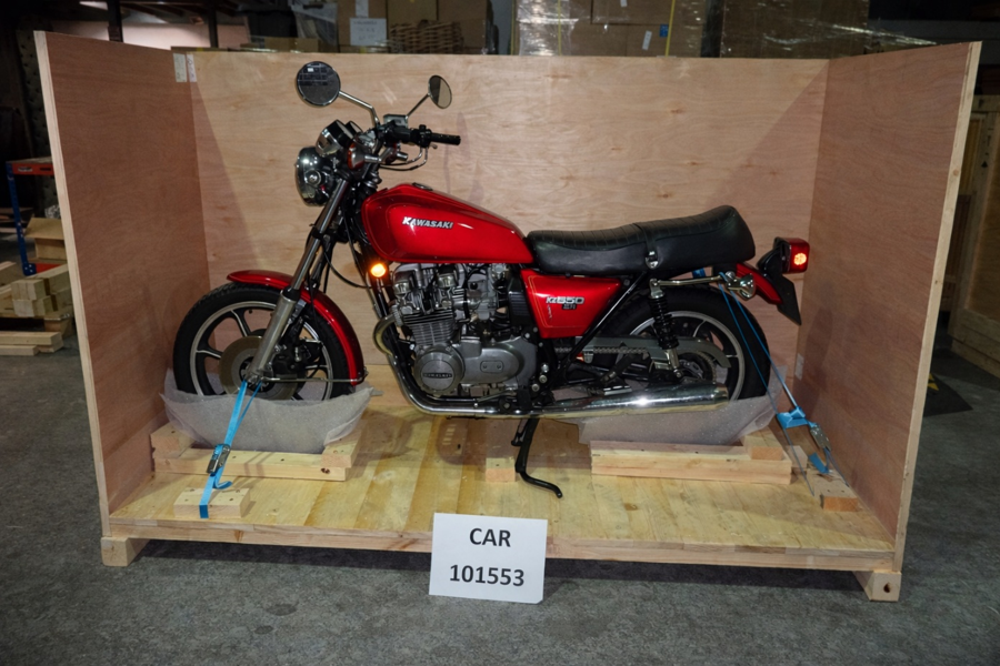 Red Kawasaki KZ650 secured in a bespoke wooden crate for shipping from Liverpool, UK, to Newark, USA, with Autoshippers.