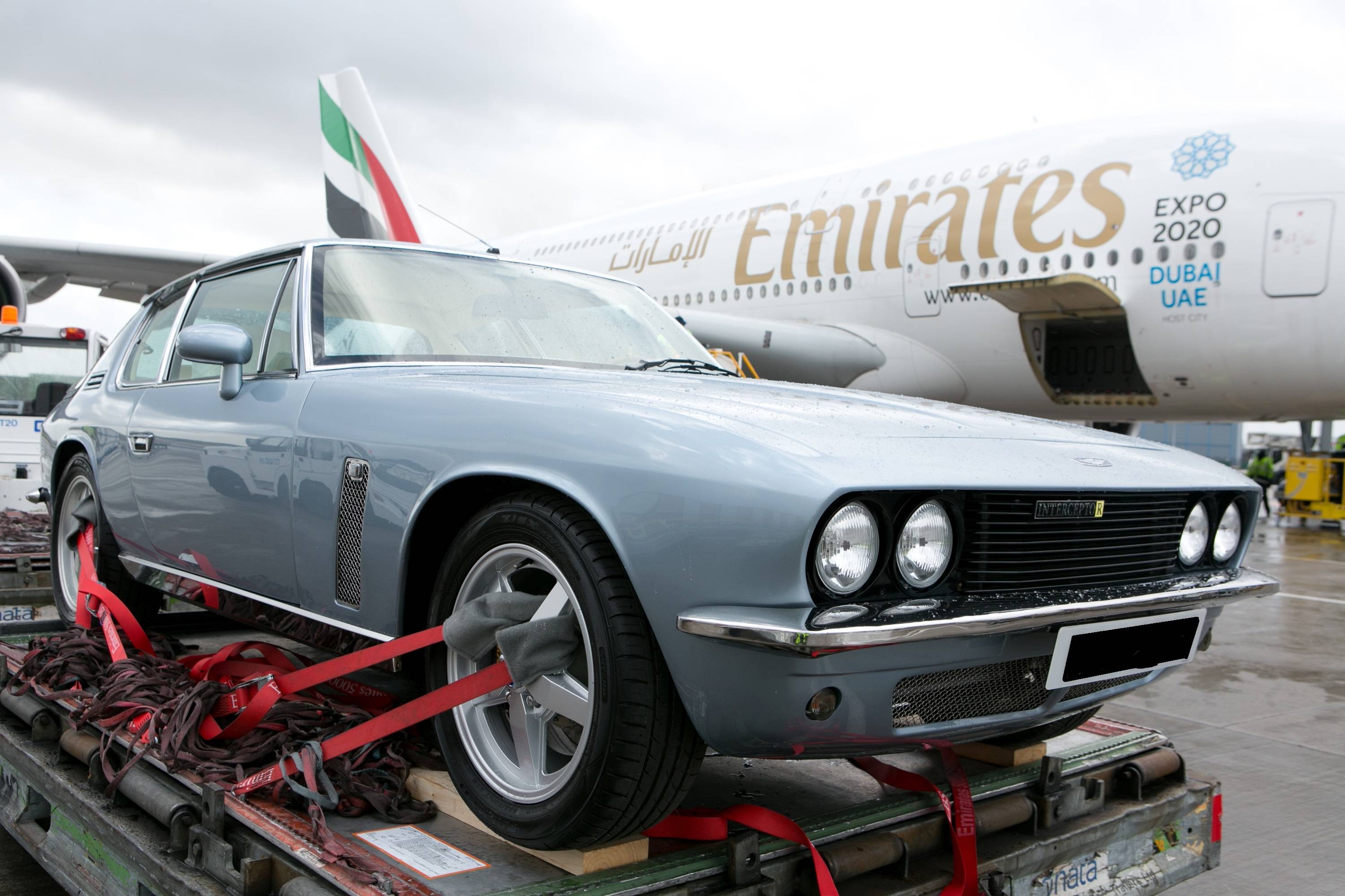 Jensen Interceptor awaiting loading - aircraft in background. Shipped via Air Freight to Dubai